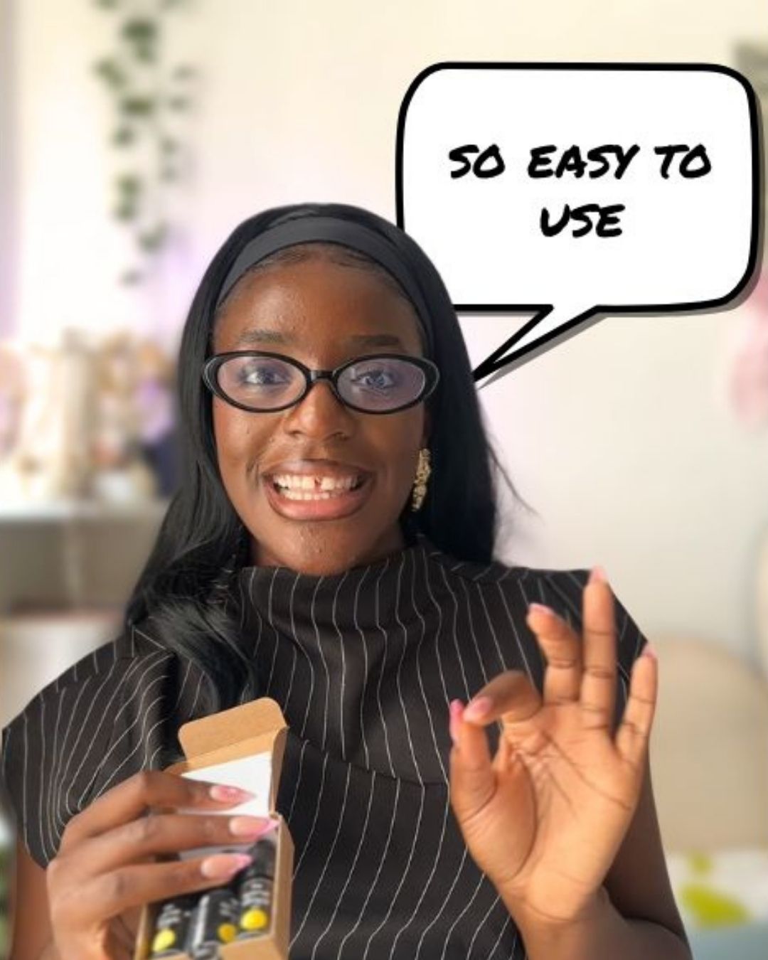 Woman holding The Wine Drops with a speech bubble saying 'So easy to use' in an indoor setting.